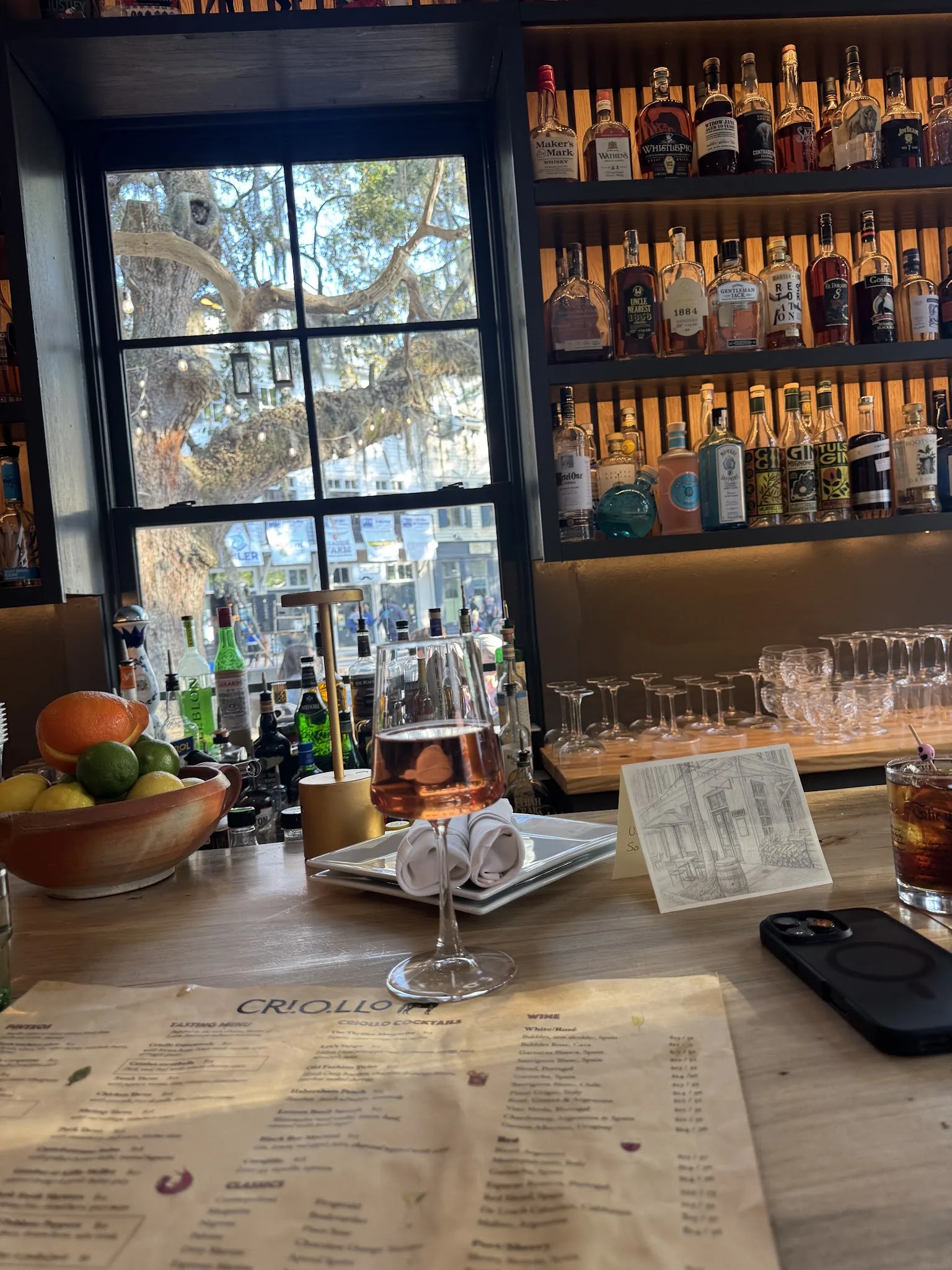 Wine and menus on the bar at Criollo in the evening