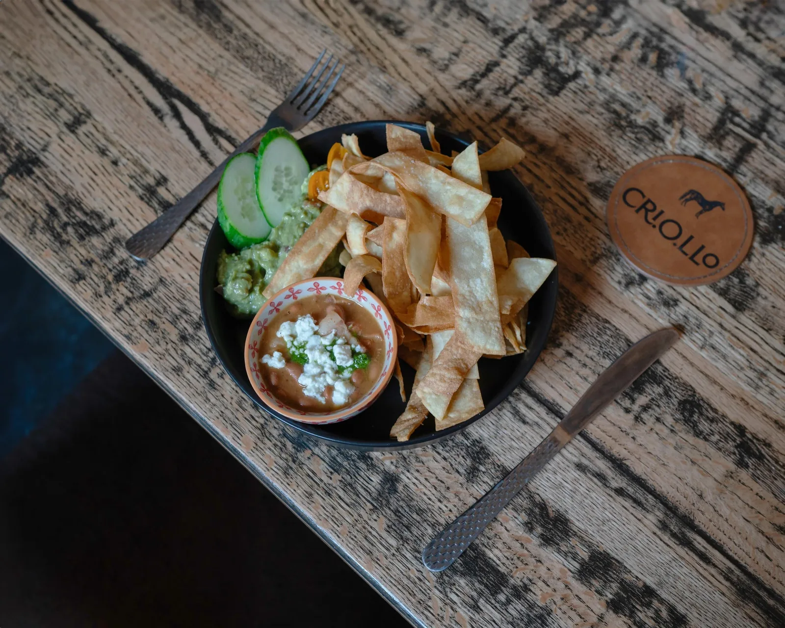 Criollo guacamole with brown beans and house-made tortilla strips